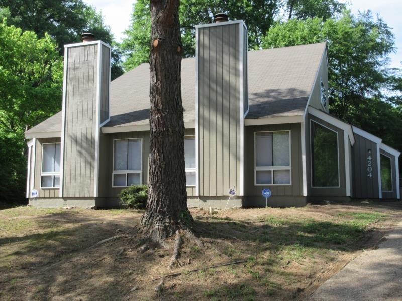 4202 Crain Road Memphis, TN 38128 - Photo 9 of 16 front view of a house with a yard