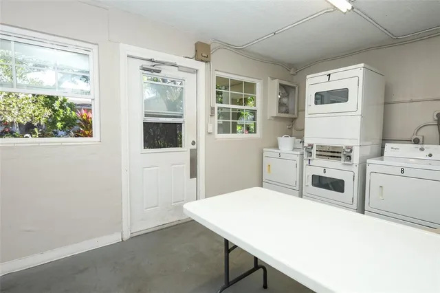 a swimming pool with outdoor seating and garden