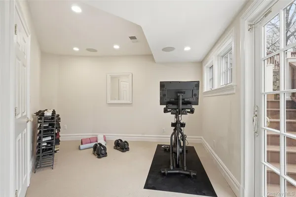 a view of a livingroom with furniture and a window