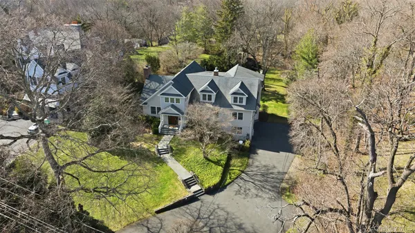 aerial view of a house with a yard