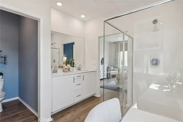a spacious bathroom with a sink and a mirror