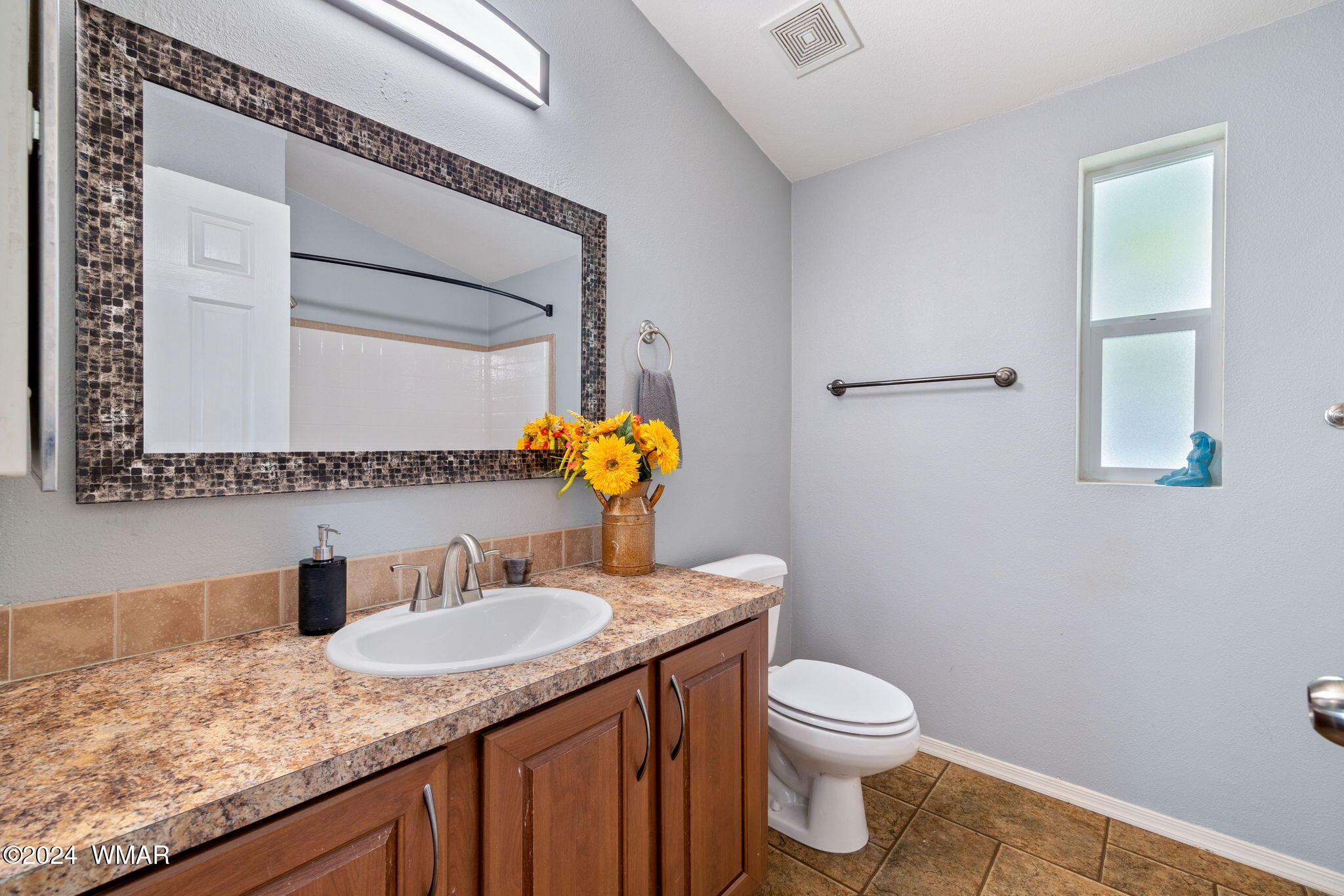 4286 East Blue Ridge Loop Pinetop, AZ 85935 - Photo 14 of 29 a bathroom with a granite countertop sink a toilet and mirror