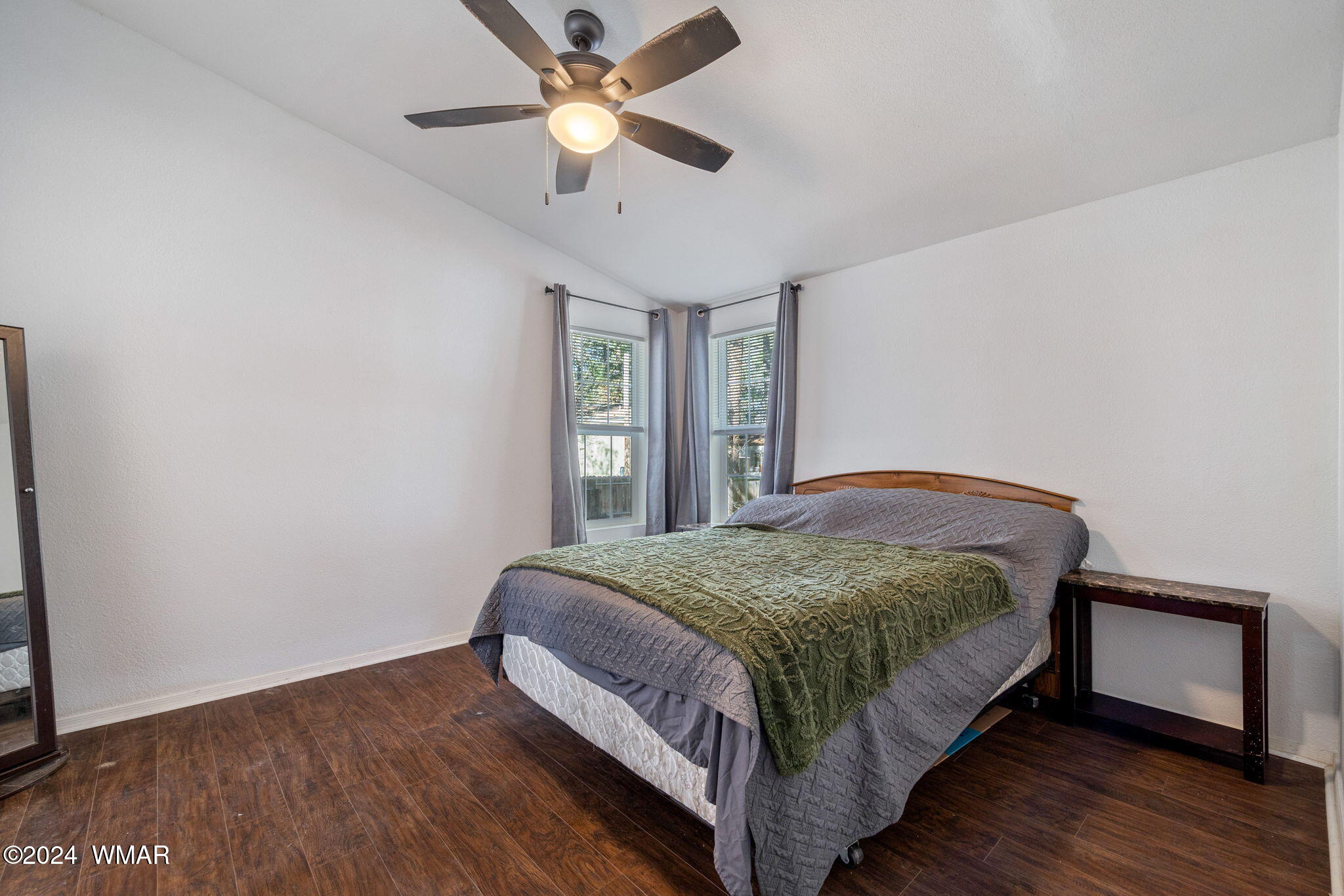 4286 East Blue Ridge Loop Pinetop, AZ 85935 - Photo 15 of 29 a bedroom with a bed and a ceiling fan