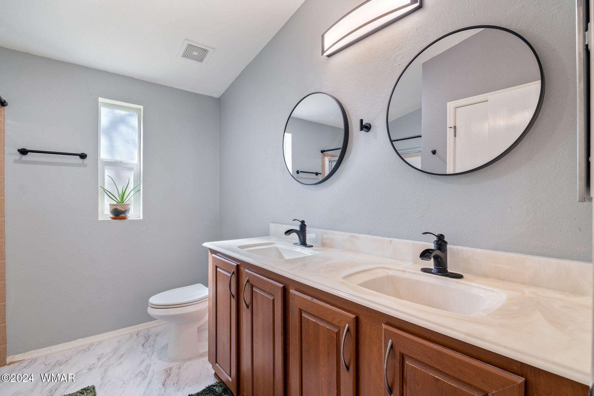 4286 East Blue Ridge Loop Pinetop, AZ 85935 - Photo 18 of 29 a bathroom with a sink a toilet and a mirror