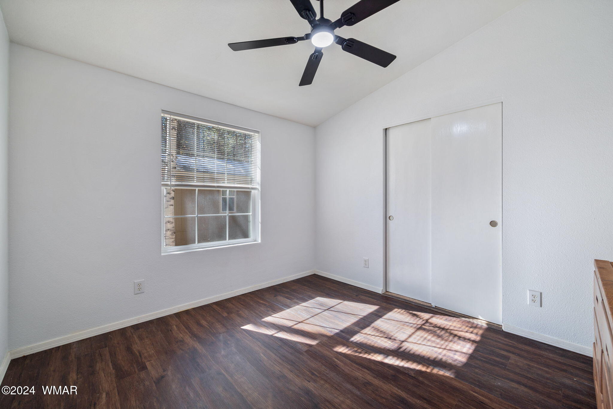 4286 East Blue Ridge Loop Pinetop, AZ 85935 - Photo 20 of 29 a view of empty room with wooden floor and fan