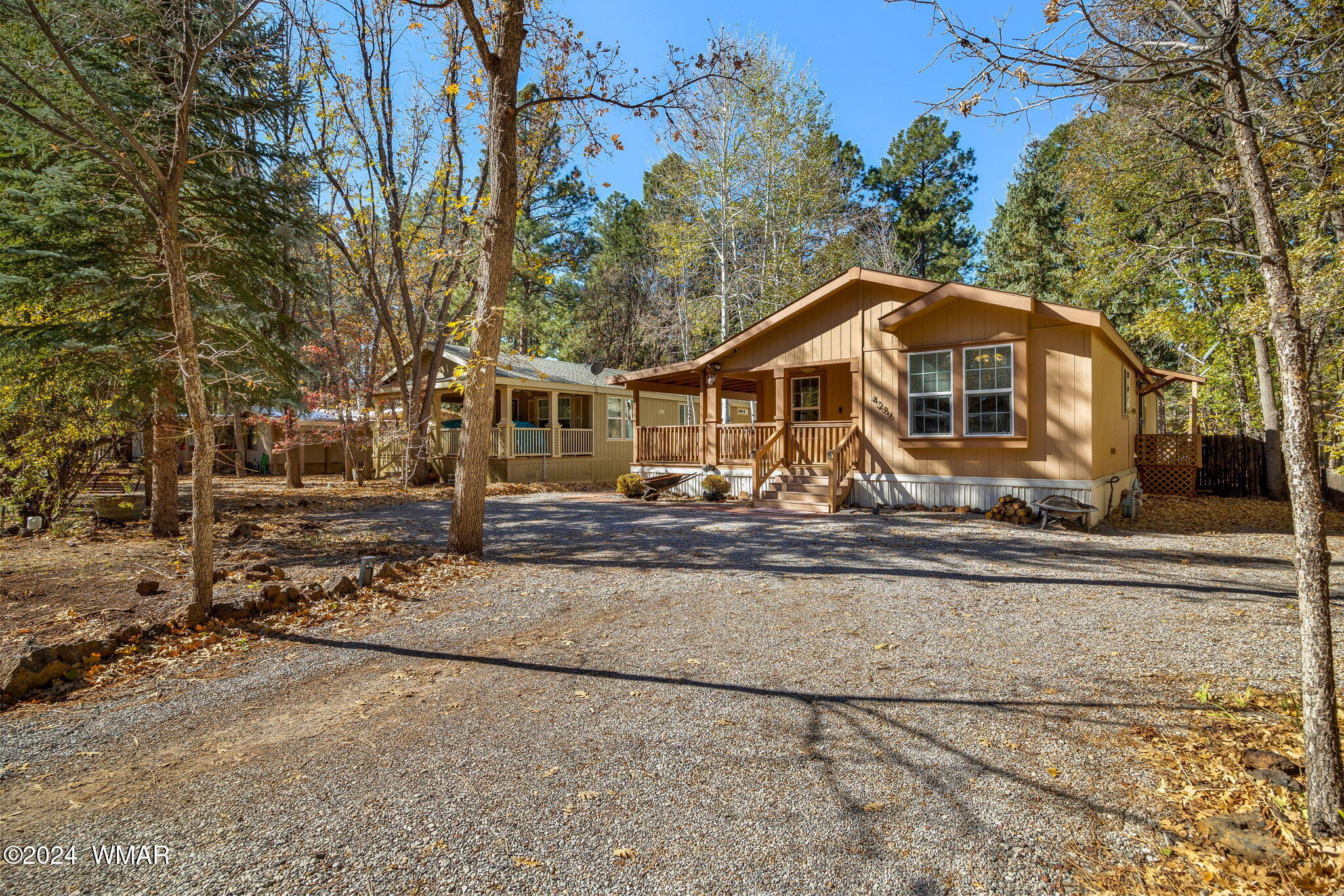 4286 East Blue Ridge Loop Pinetop, AZ 85935 - Photo 2 of 29 a front view of a house with a yard