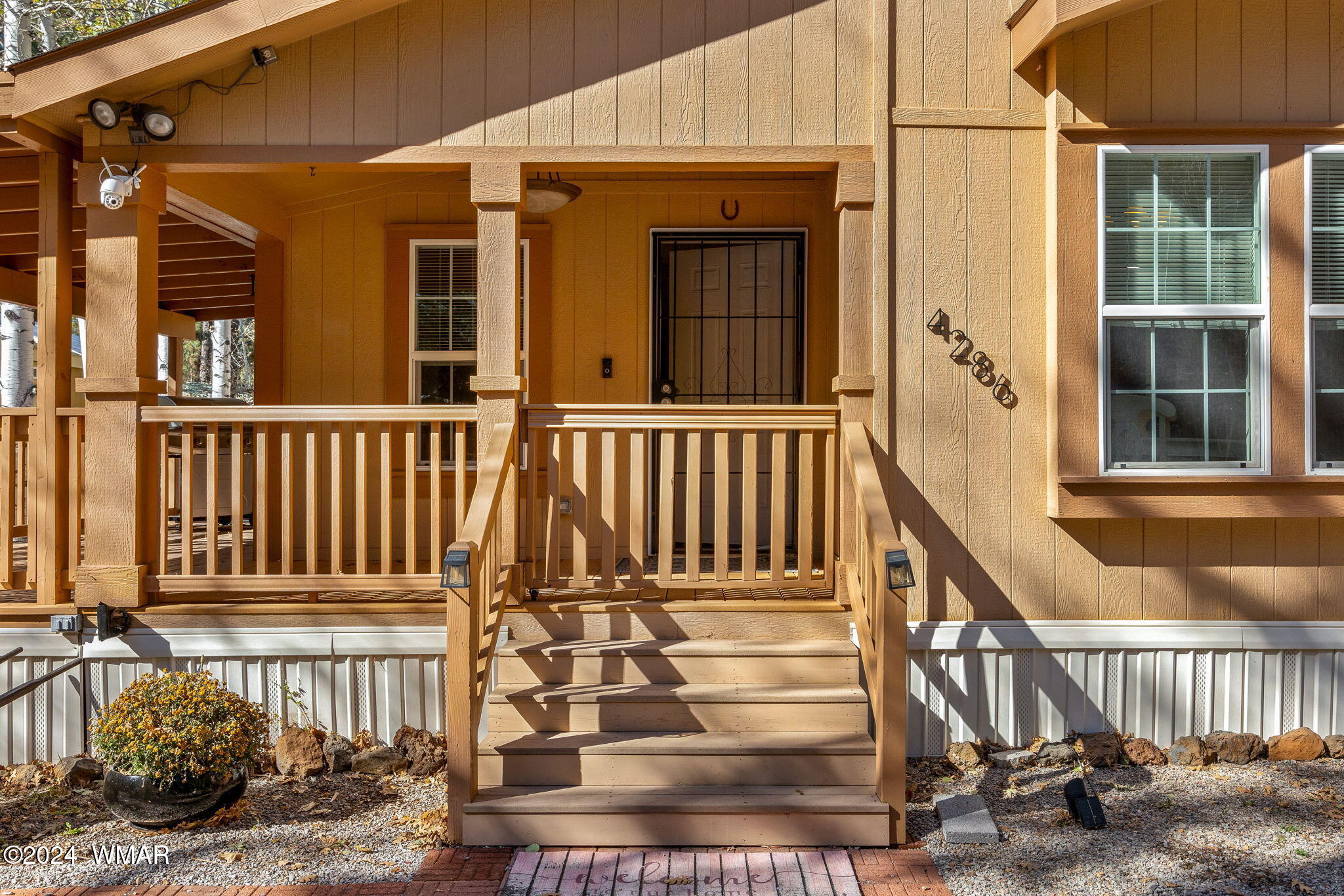 4286 East Blue Ridge Loop Pinetop, AZ 85935 - Photo 4 of 29 a view of a house with wooden fence
