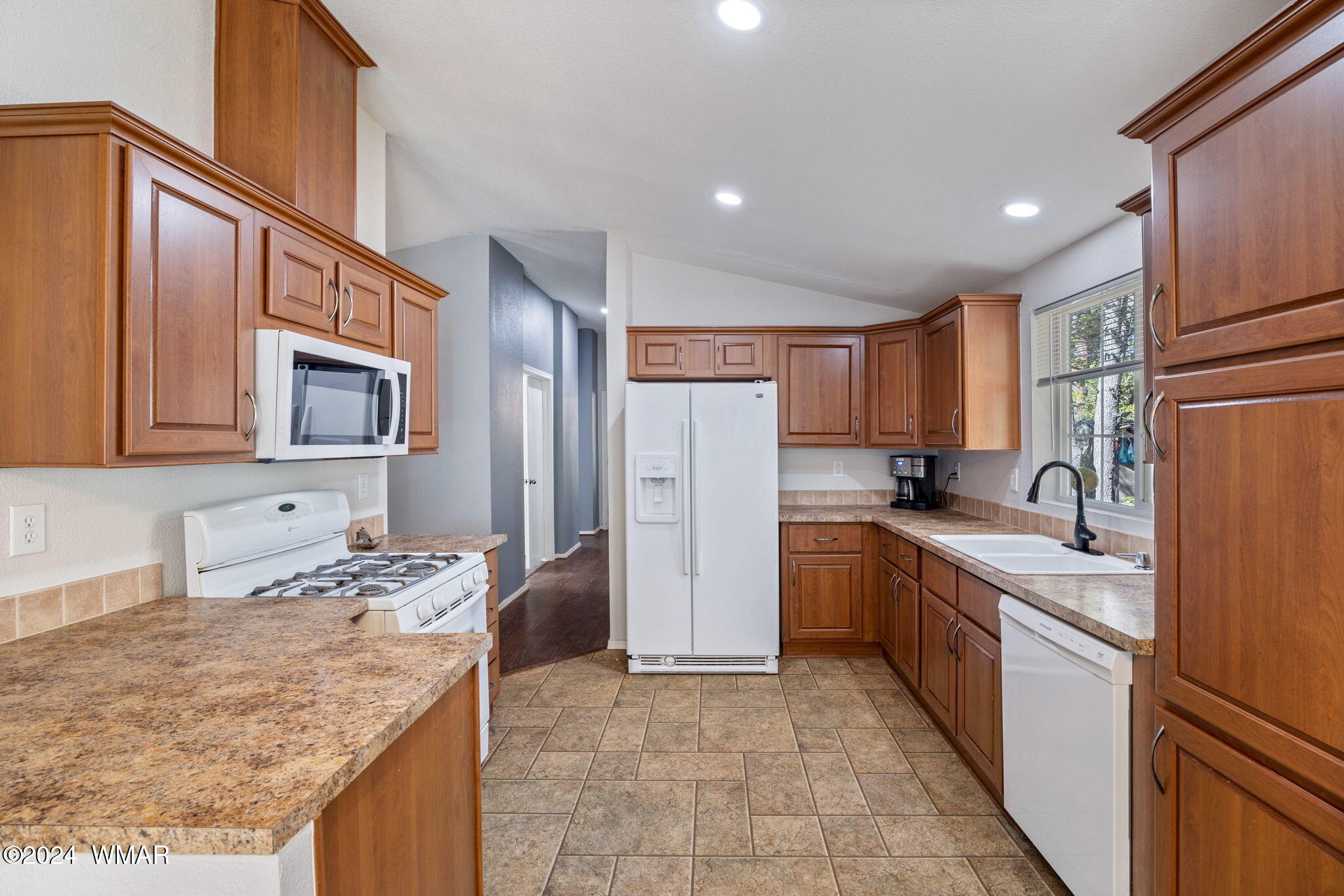4286 East Blue Ridge Loop Pinetop, AZ 85935 - Photo 9 of 29 a kitchen with stainless steel appliances granite countertop a sink stove and refrigerator