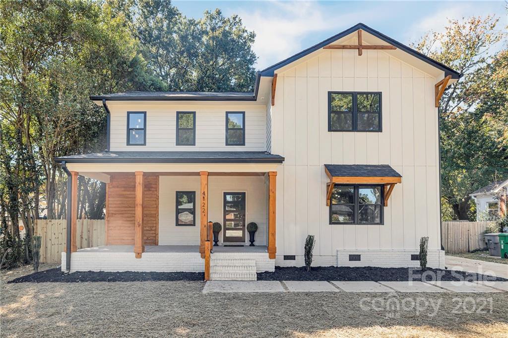 4122 Applegate Road Charlotte, NC 28209 - Photo 1 of 17 a view of a house with a small yard and large tree