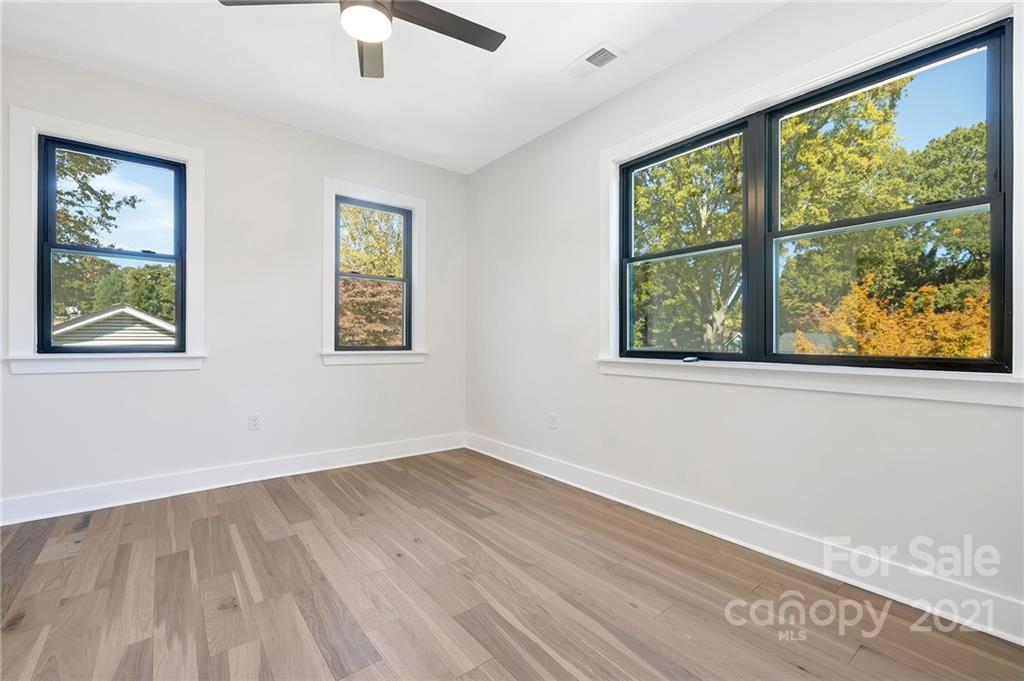 4122 Applegate Road Charlotte, NC 28209 - Photo 13 of 17 wooden floor in an empty room with a window