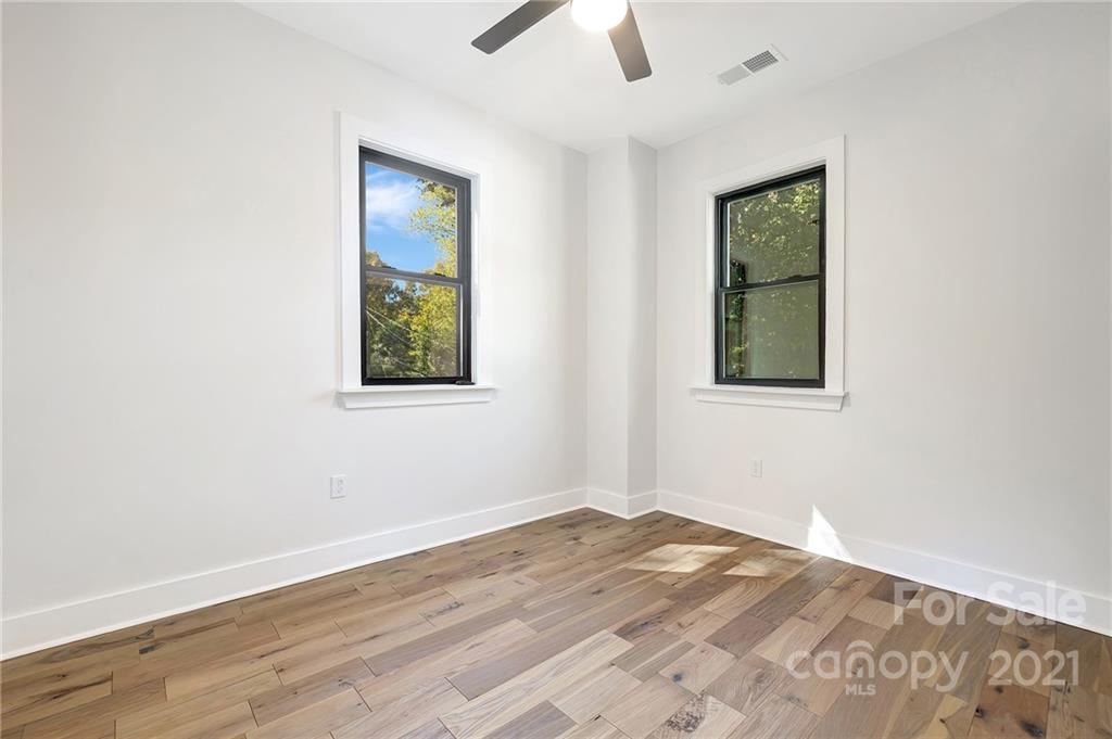 4122 Applegate Road Charlotte, NC 28209 - Photo 14 of 17 an empty room with a window and a ceiling fan