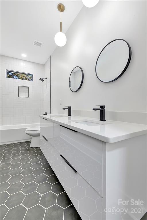 4122 Applegate Road Charlotte, NC 28209 - Photo 15 of 17 a bathroom with a double vanity sink mirror and toilet