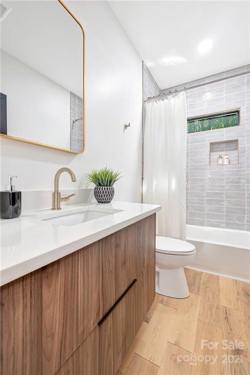 4122 Applegate Road Charlotte, NC 28209 - Photo 8 of 17 a bathroom with a sink and a mirror