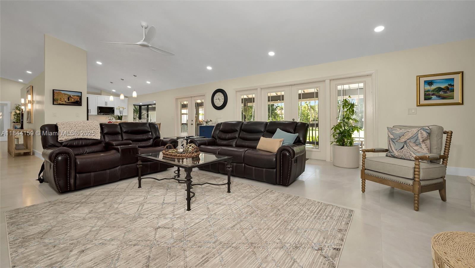 8375 Southwest 78th Street Miami, FL 33143 - Photo 15 of 45 a living room with furniture and a large window