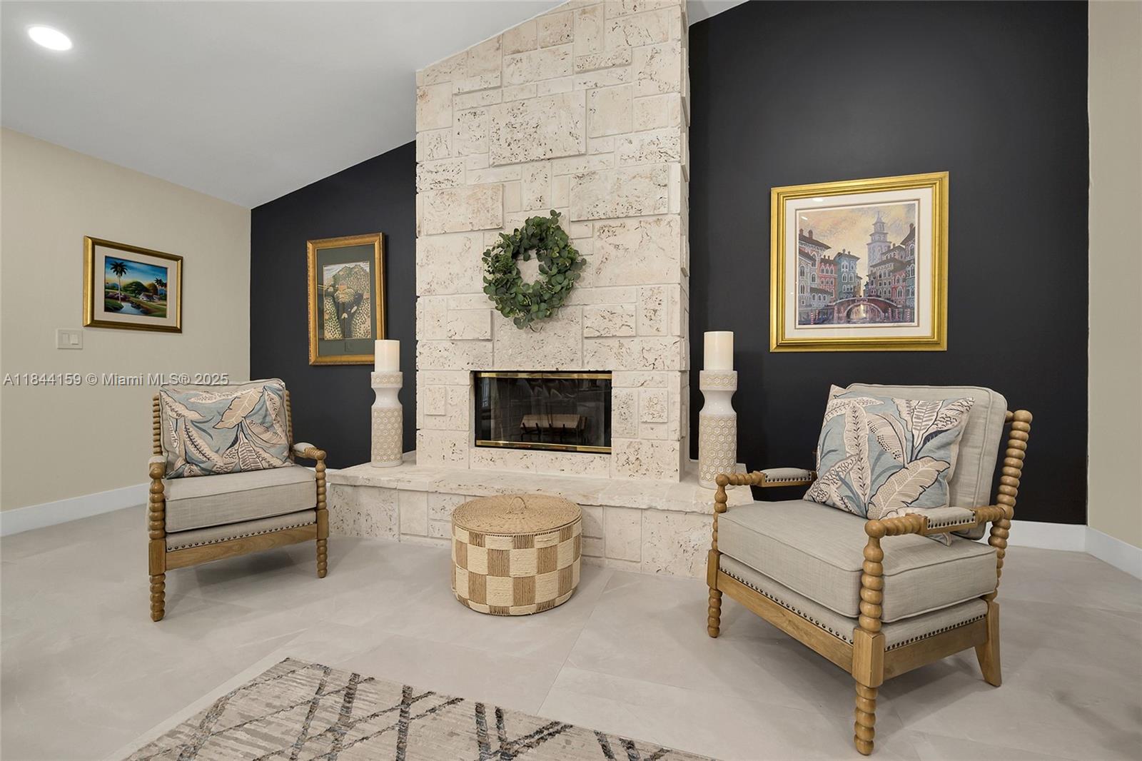 8375 Southwest 78th Street Miami, FL 33143 - Photo 16 of 45 a living room with furniture and a fireplace