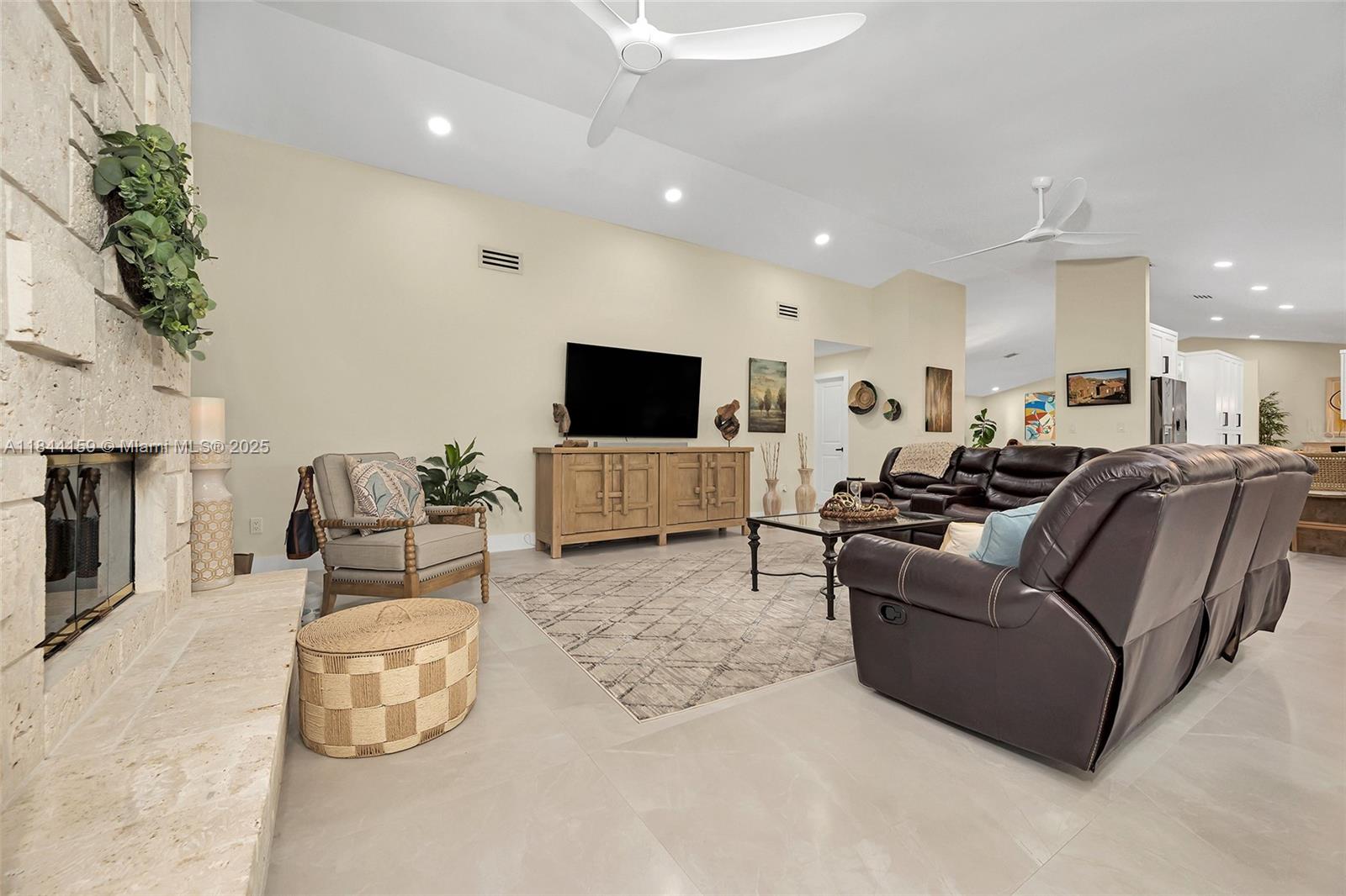 8375 Southwest 78th Street Miami, FL 33143 - Photo 17 of 45 a living room with furniture and a flat screen tv