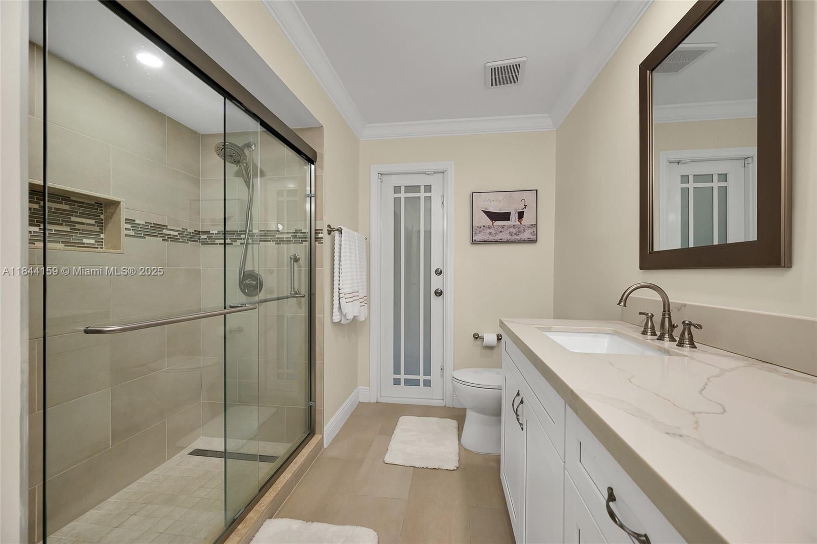 8375 Southwest 78th Street Miami, FL 33143 - Photo 22 of 45 a bathroom with a double vanity sink mirror and shower
