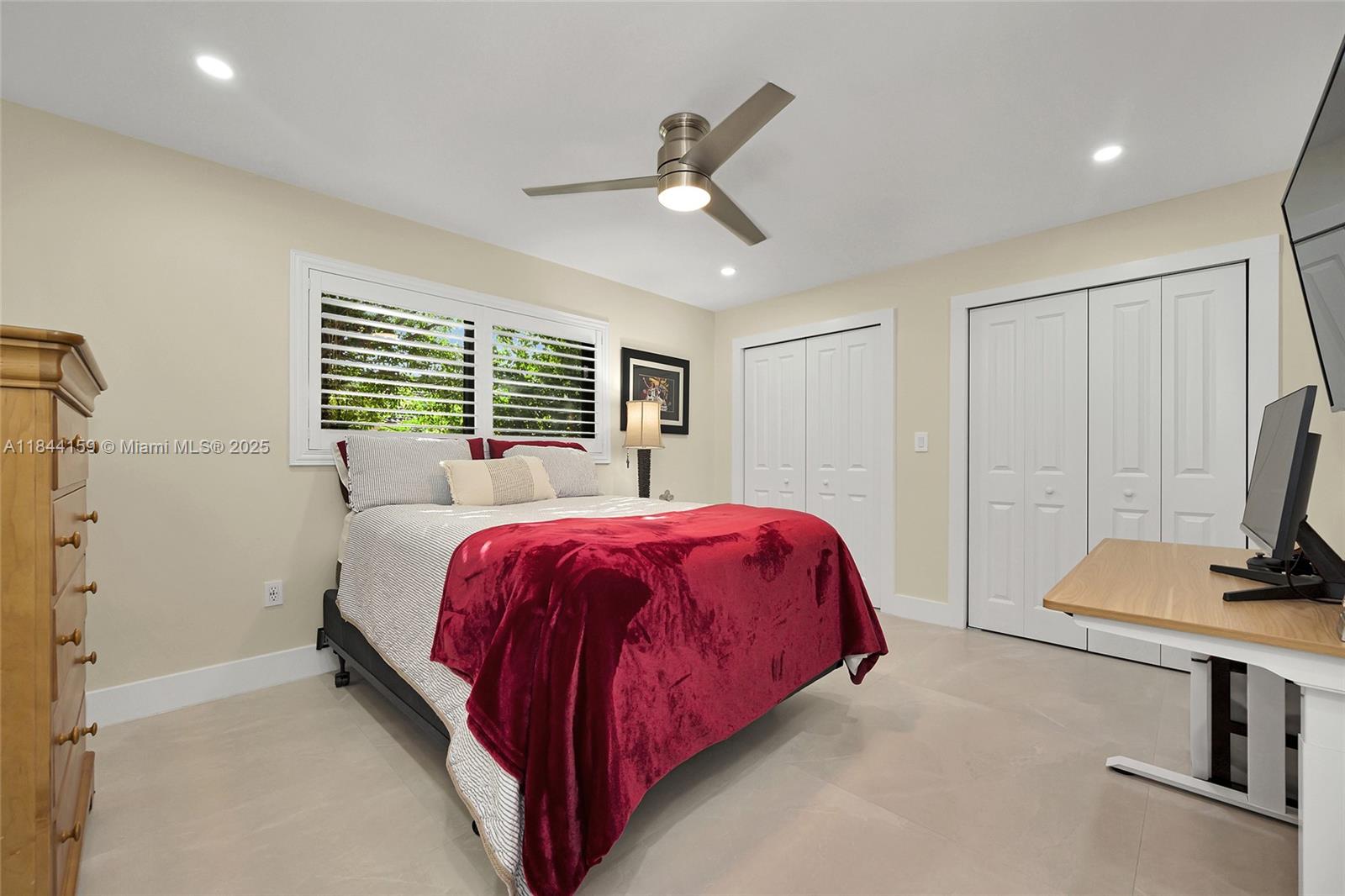 8375 Southwest 78th Street Miami, FL 33143 - Photo 23 of 45 a bed room with a bed and a flat tv screen