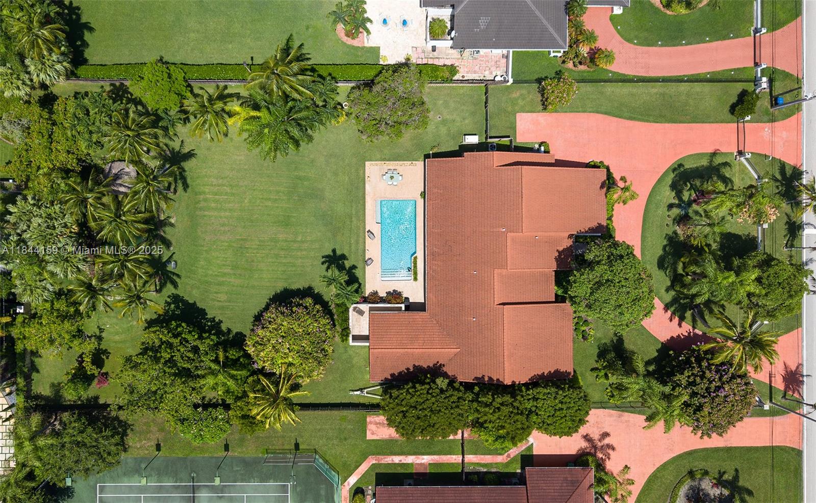 8375 Southwest 78th Street Miami, FL 33143 - Photo 3 of 45 an aerial view of a house with a yard and lake view