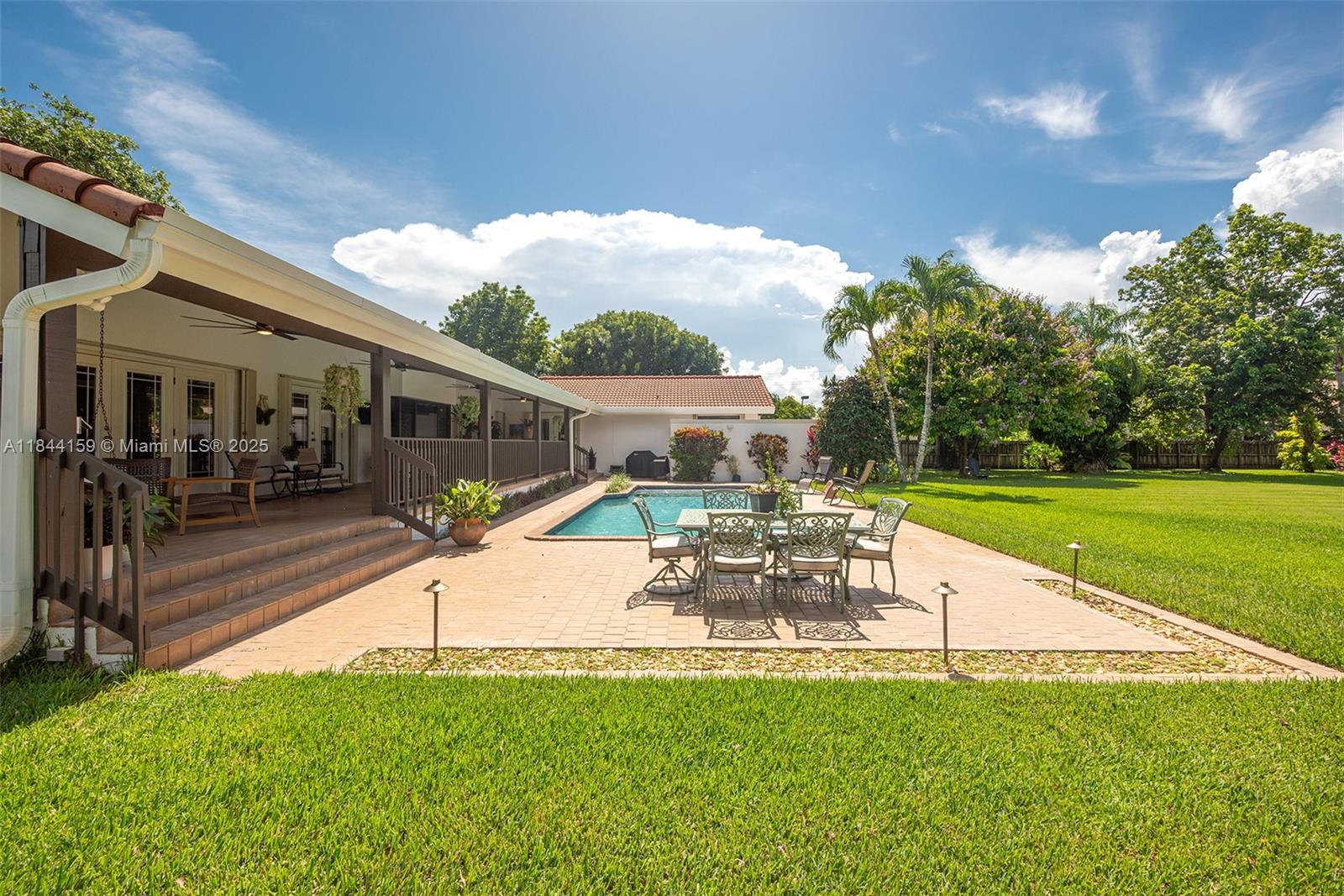 8375 Southwest 78th Street Miami, FL 33143 - Photo 32 of 45 a view of a house with a yard porch and sitting area