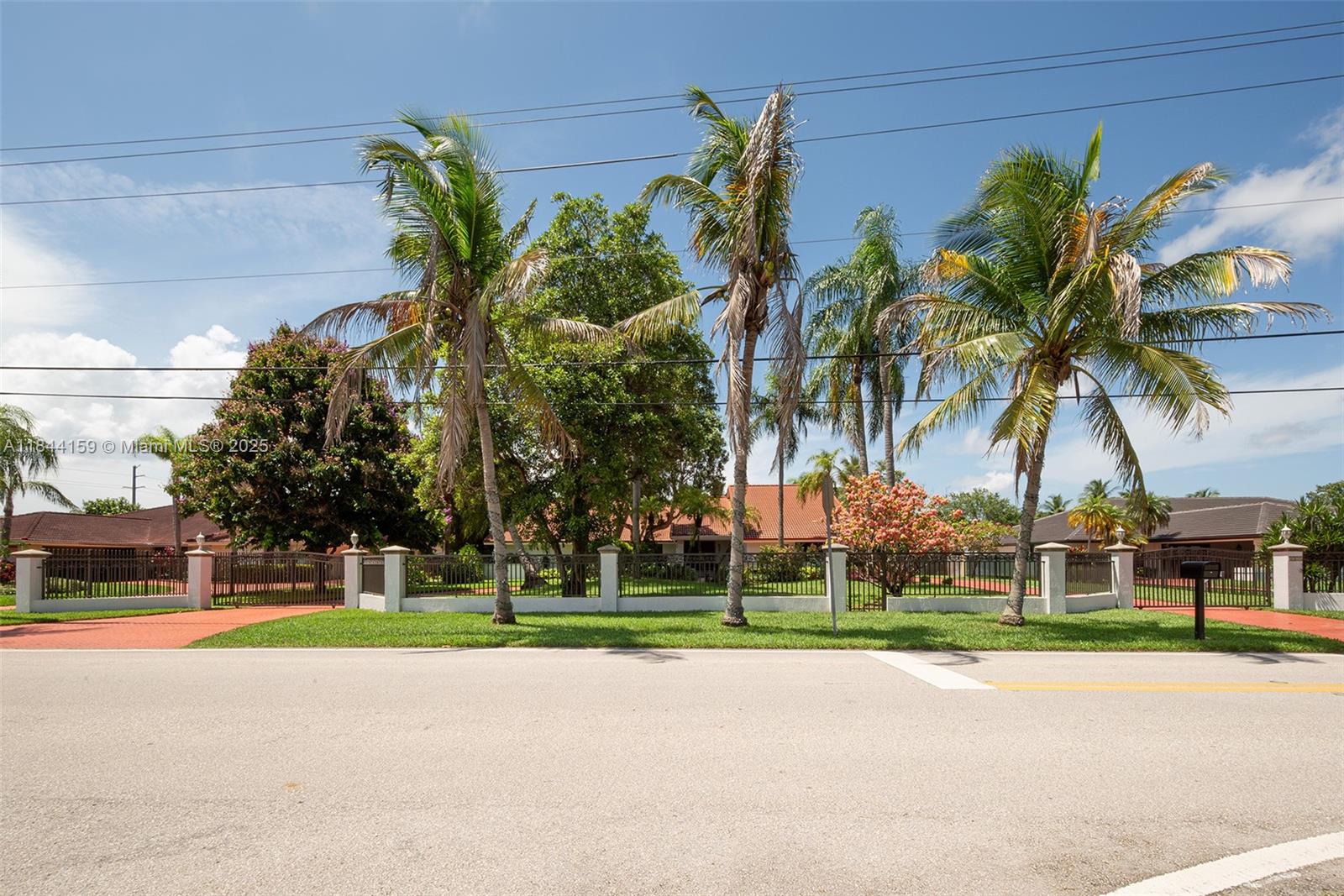 8375 Southwest 78th Street Miami, FL 33143 - Photo 4 of 45 a view of a swimming pool with palm trees