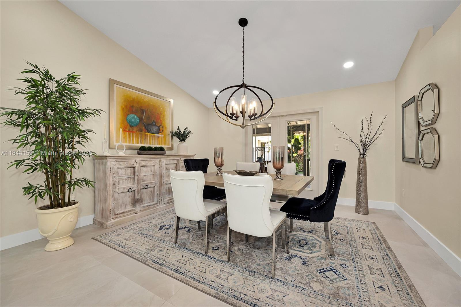 8375 Southwest 78th Street Miami, FL 33143 - Photo 9 of 45 a view of a dining room with furniture window and wooden floor