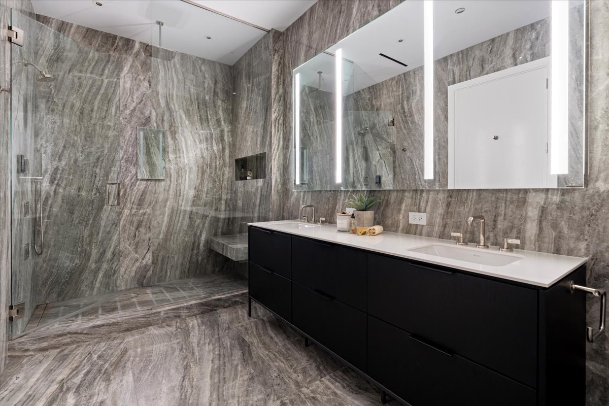 14 West Superior Street, Unit 5003 Chicago, IL 60654 - Photo 16 of 37 a bathroom with a sink and a mirror