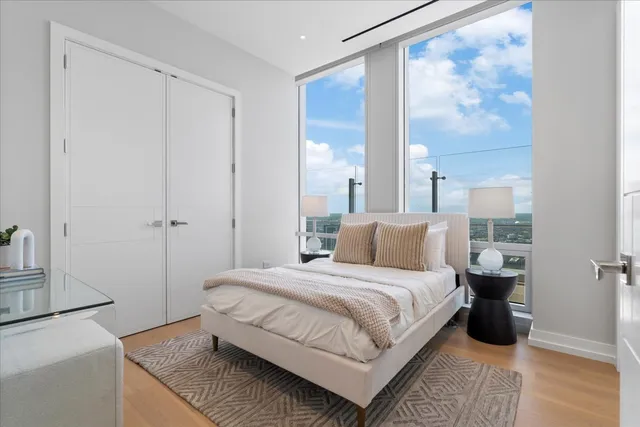 a bedroom with a bed and a cabinets