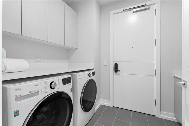 a view of storage and utility room with washer and dryer