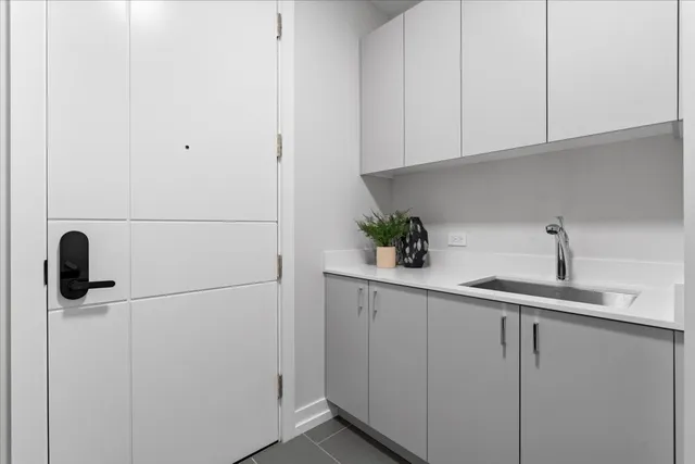 a kitchen with appliances cabinets and a sink