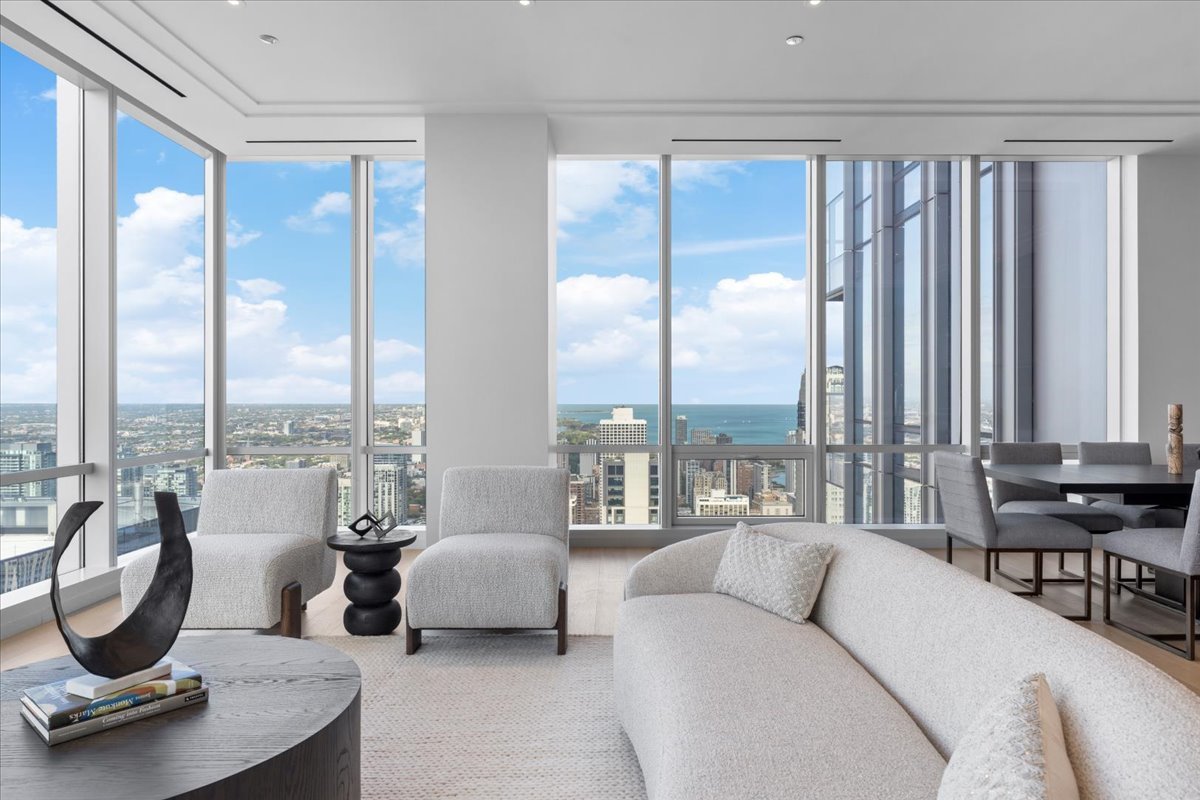 14 West Superior Street, Unit 5003 Chicago, IL 60654 - Photo 7 of 37 a living room with furniture and a large window