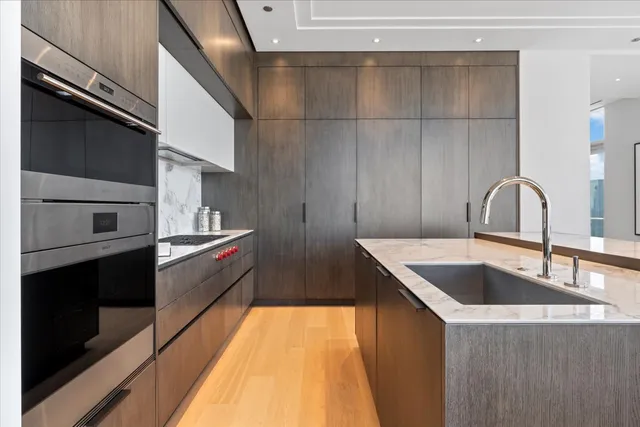 a kitchen with a sink and a refrigerator