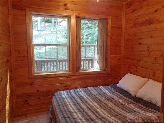 717 F Deep Ford Road Lansing, NC 28643 - Photo 9 of 28 a bedroom with a bed and a window