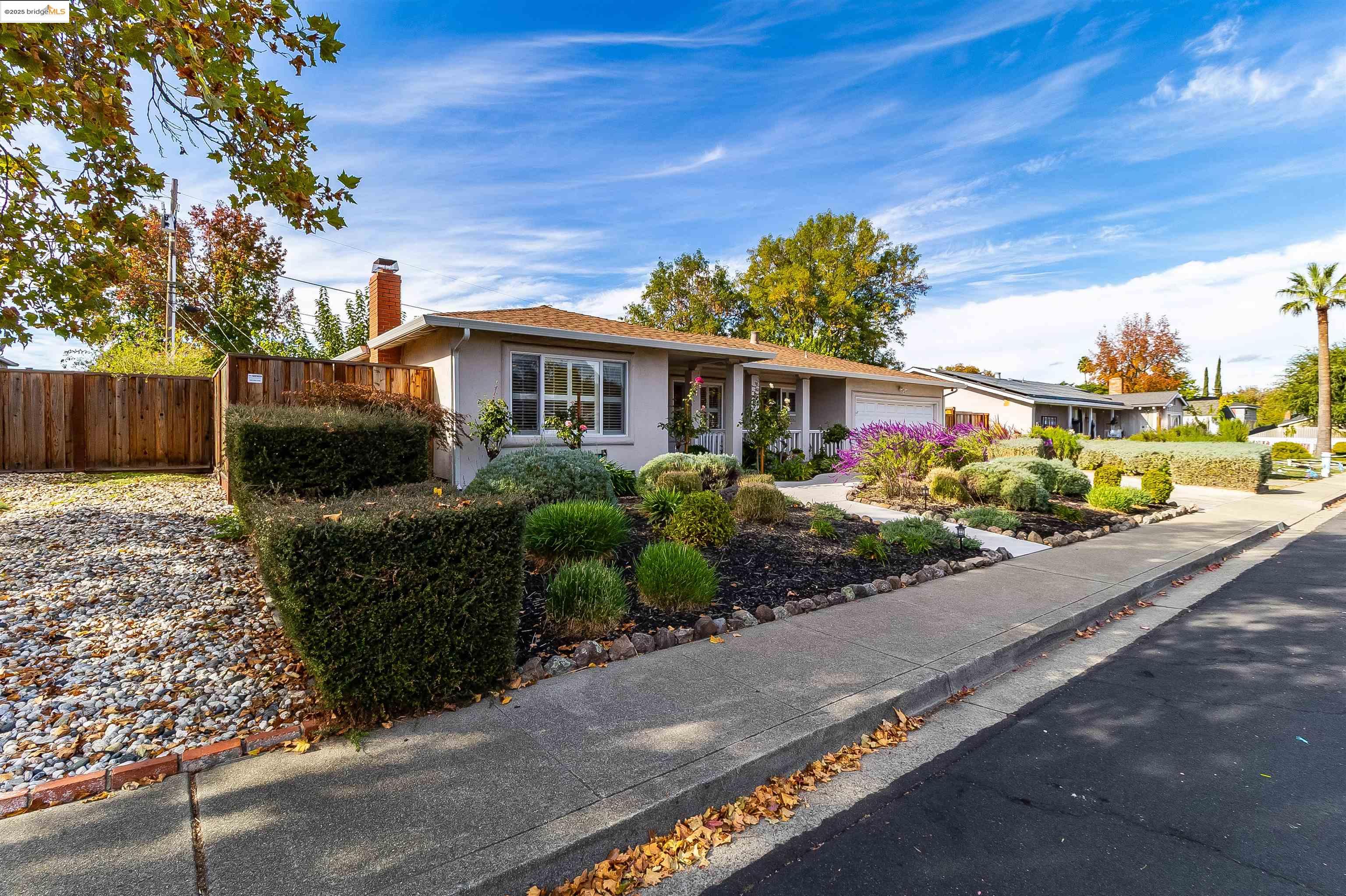 4656 Benbow Court Concord, CA 94521 - Photo 4 of 32 a front view of a house with a garden