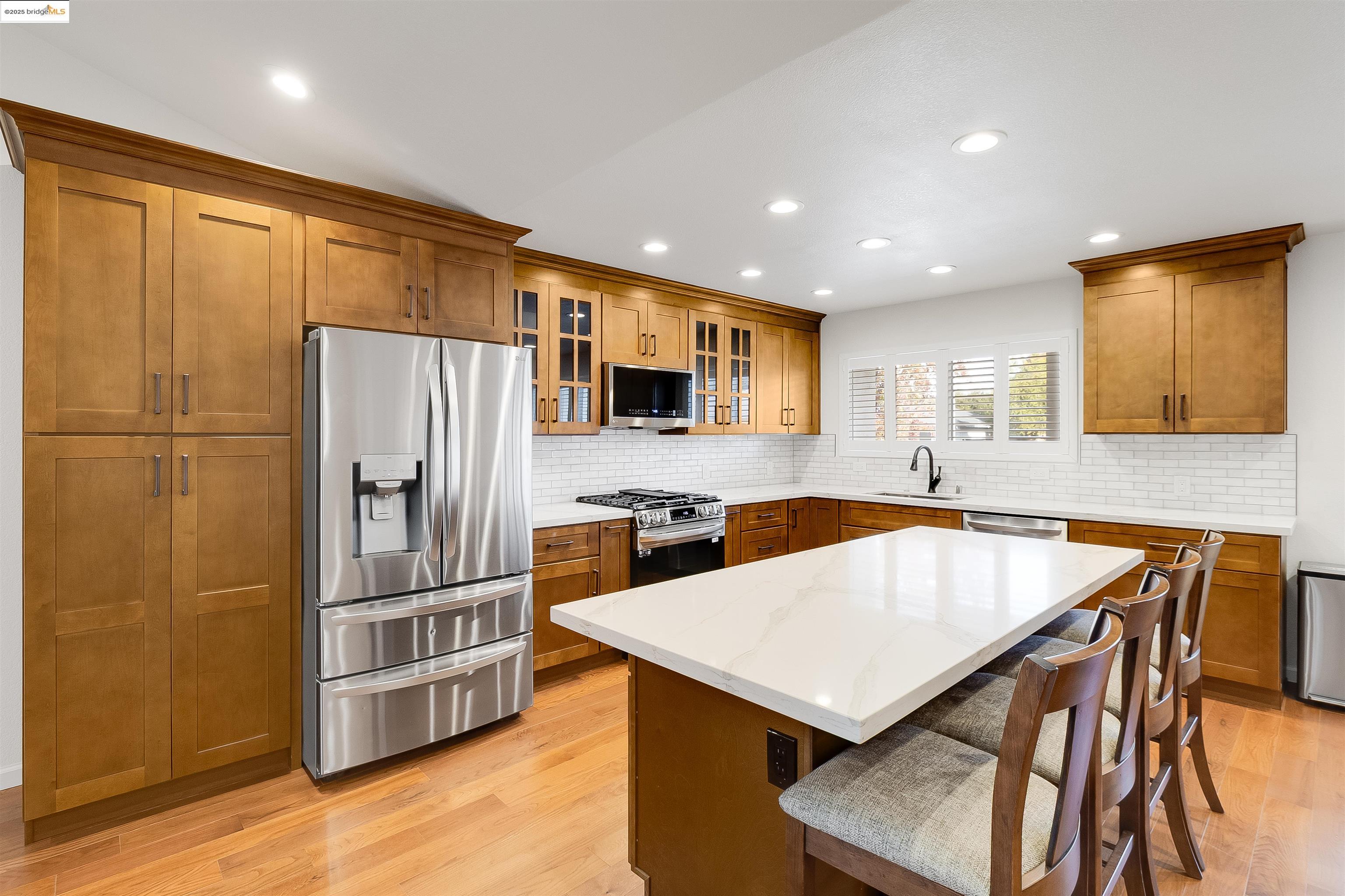 4656 Benbow Court Concord, CA 94521 - Photo 6 of 32 a kitchen with a refrigerator a sink and a stove top oven