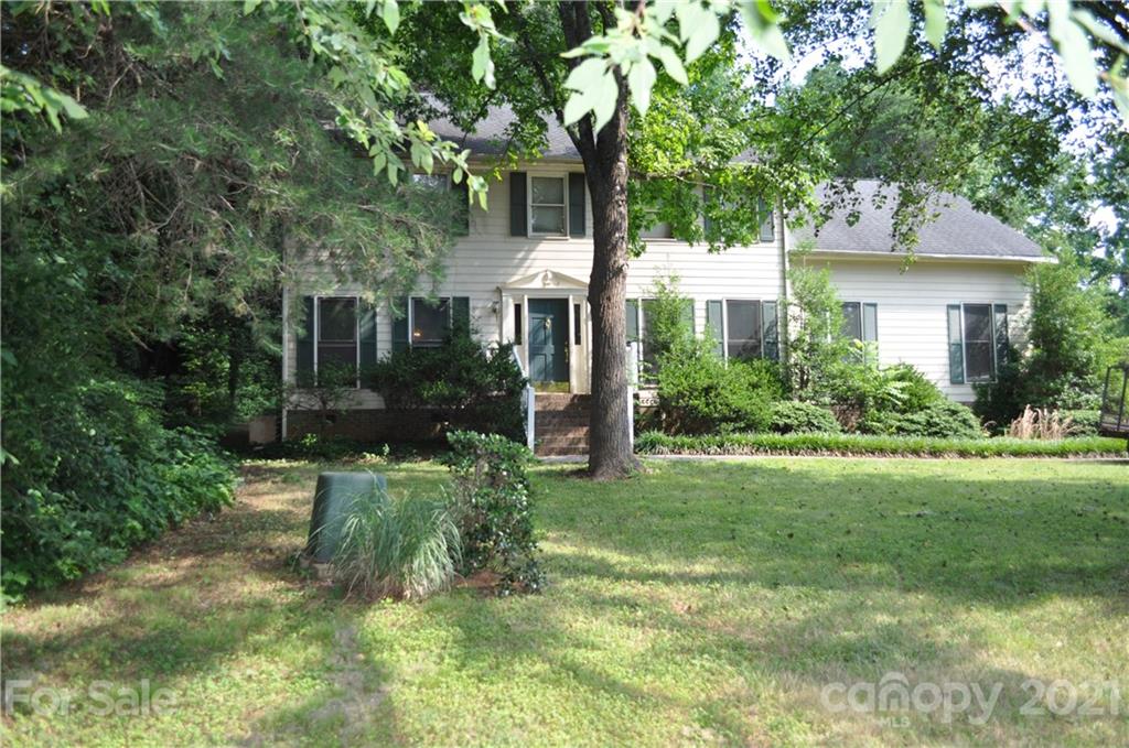10024 Fireside Lane Charlotte, NC 28215 - Photo 1 of 18 a view of backyard of house with green space
