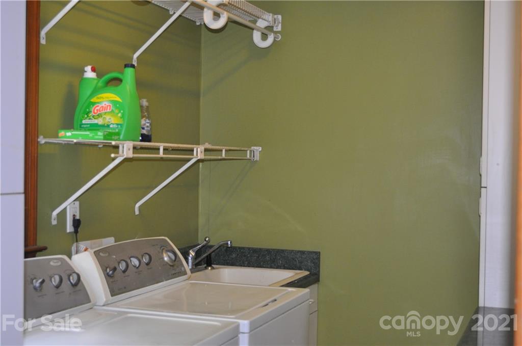 10024 Fireside Lane Charlotte, NC 28215 - Photo 13 of 18 a bathroom with a sink and a mirror