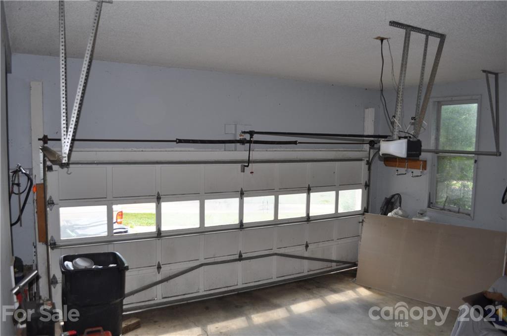 10024 Fireside Lane Charlotte, NC 28215 - Photo 15 of 18 a view of a living room with a window