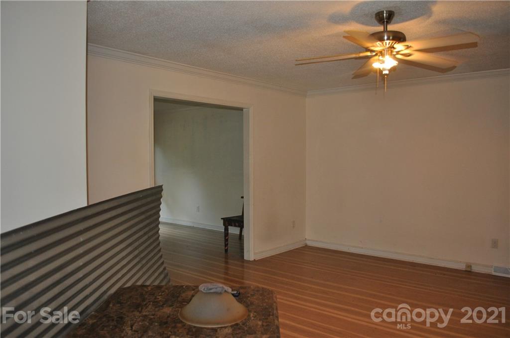 10024 Fireside Lane Charlotte, NC 28215 - Photo 7 of 18 a view of room with a fan