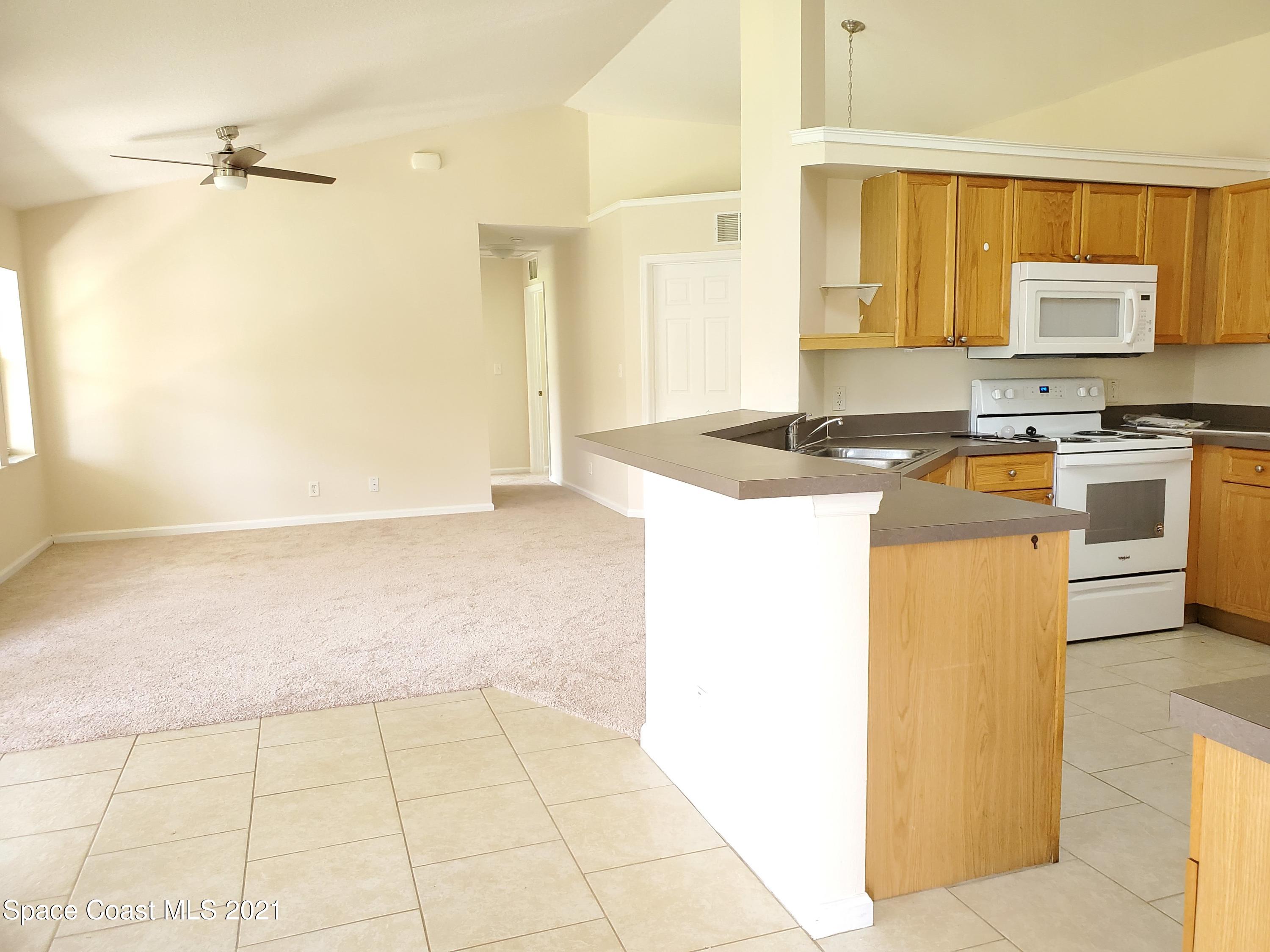 218 San Remo Road Southwest Palm Bay, FL 32908 - Photo 5 of 40 20210628_144517