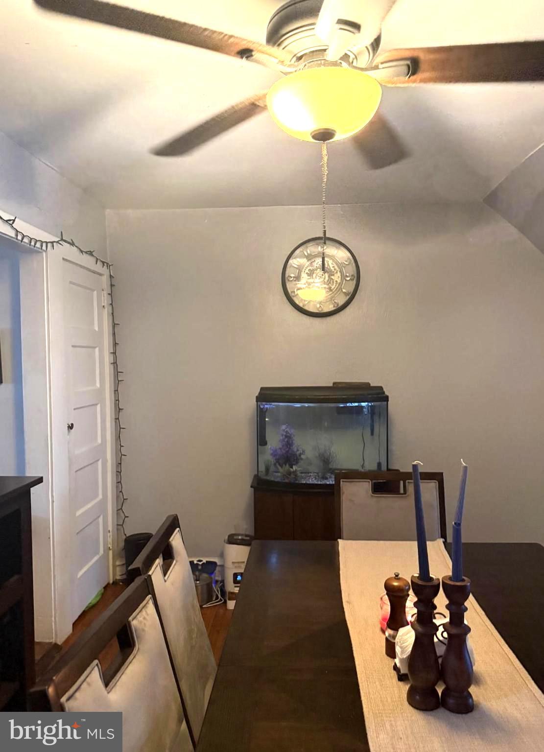 7723 Temple Road Philadelphia, PA 19150 - Photo 3 of 10 a view of a room with a dining table and chairs