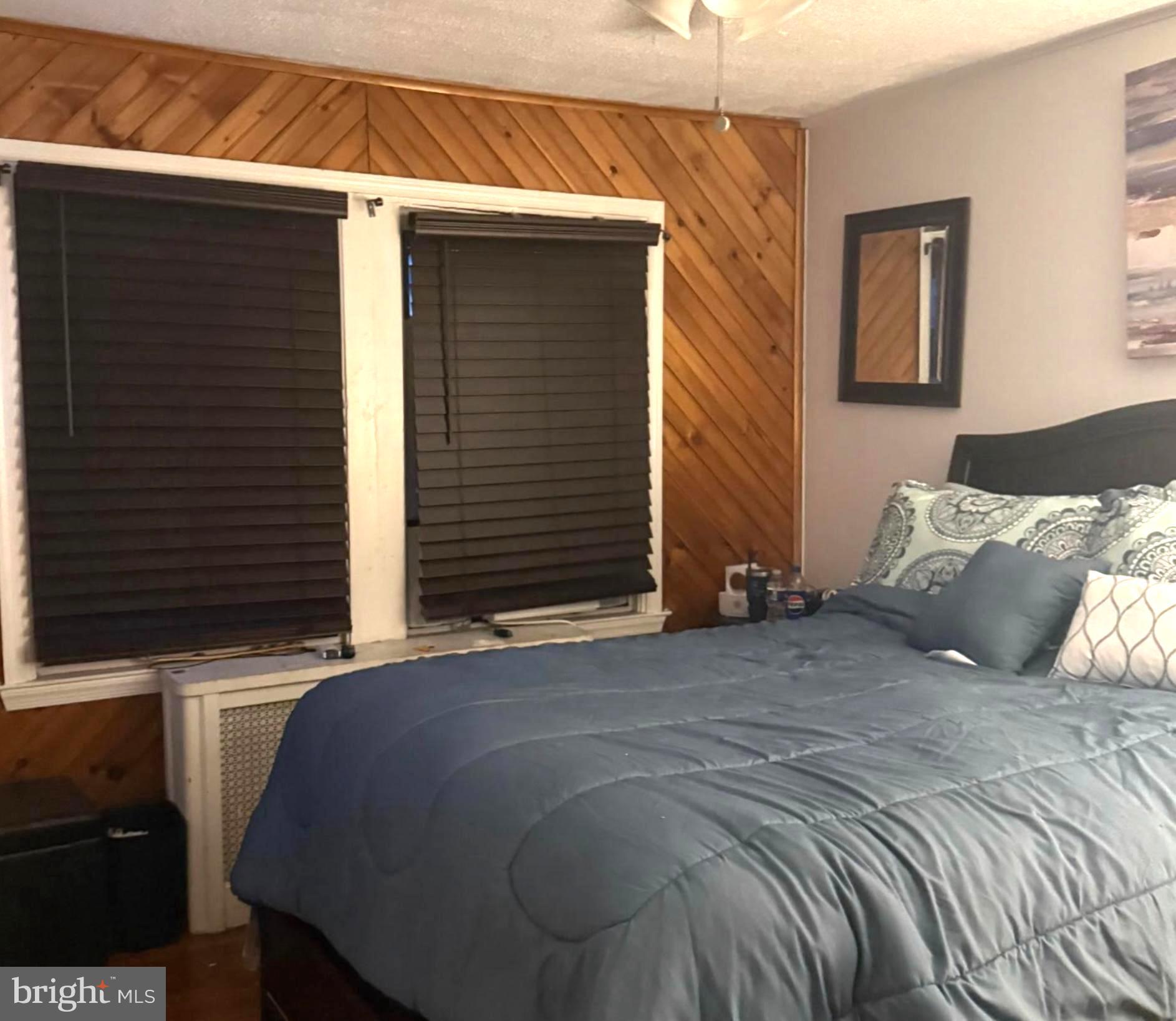 7723 Temple Road Philadelphia, PA 19150 - Photo 6 of 10 a bedroom with a bed and a window