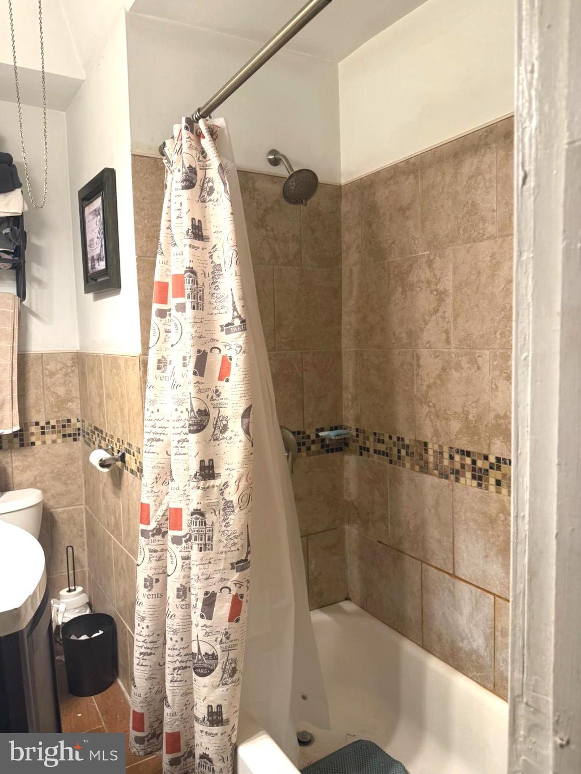 7723 Temple Road Philadelphia, PA 19150 - Photo 7 of 10 a bathroom with a bathtub and shower