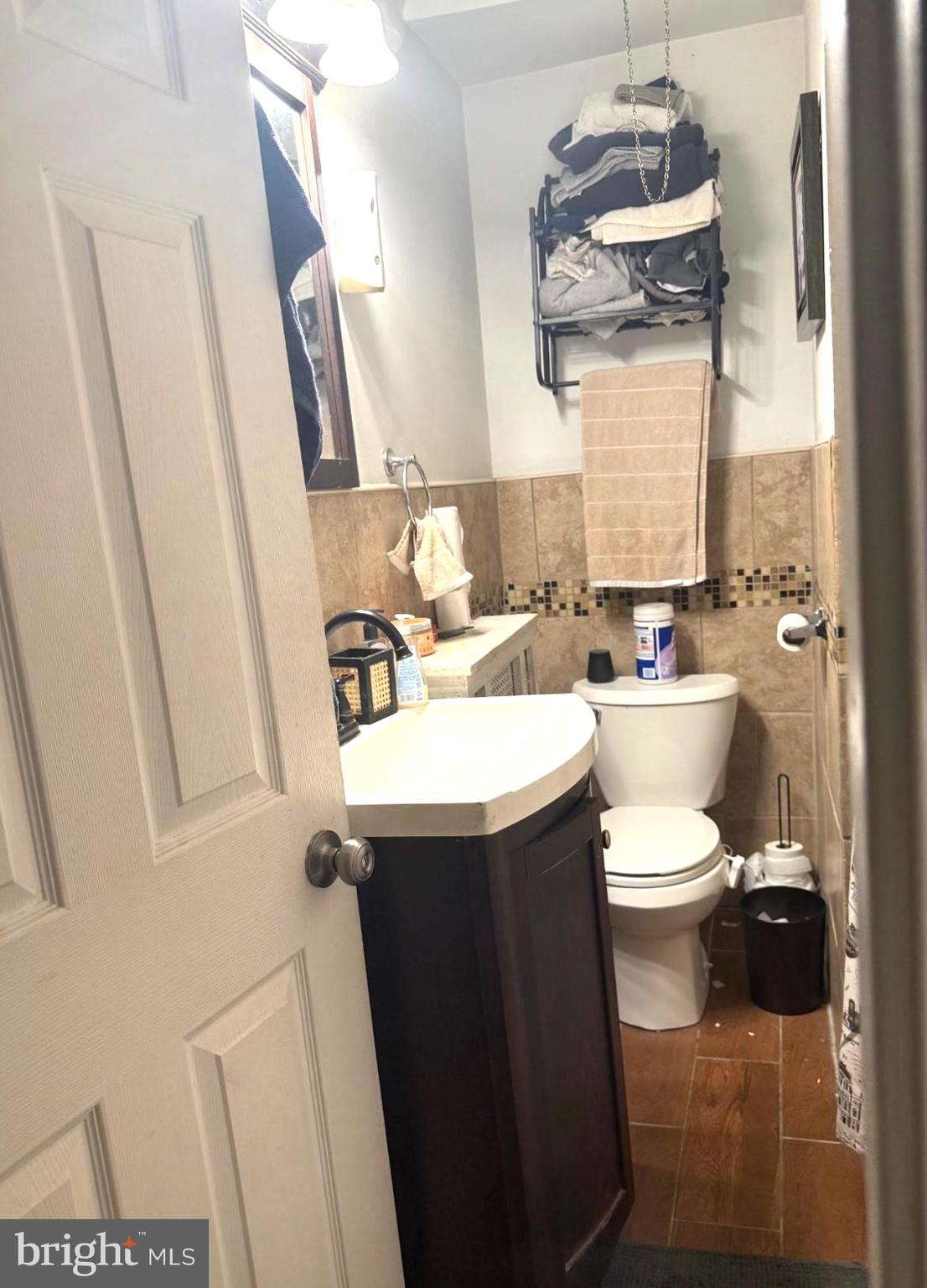 7723 Temple Road Philadelphia, PA 19150 - Photo 8 of 10 a bathroom with a sink a toilet and mirror