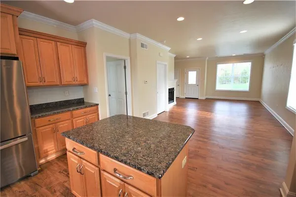 a kitchen with stainless steel appliances granite countertop a sink and cabinets