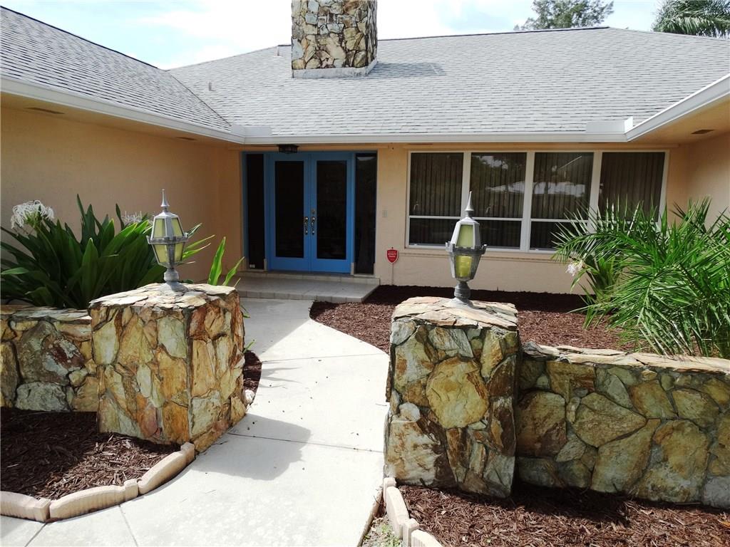 1256 Holly Cove Drive Jupiter, FL 33458 - Photo 2 of 20 a house view with a outdoor space