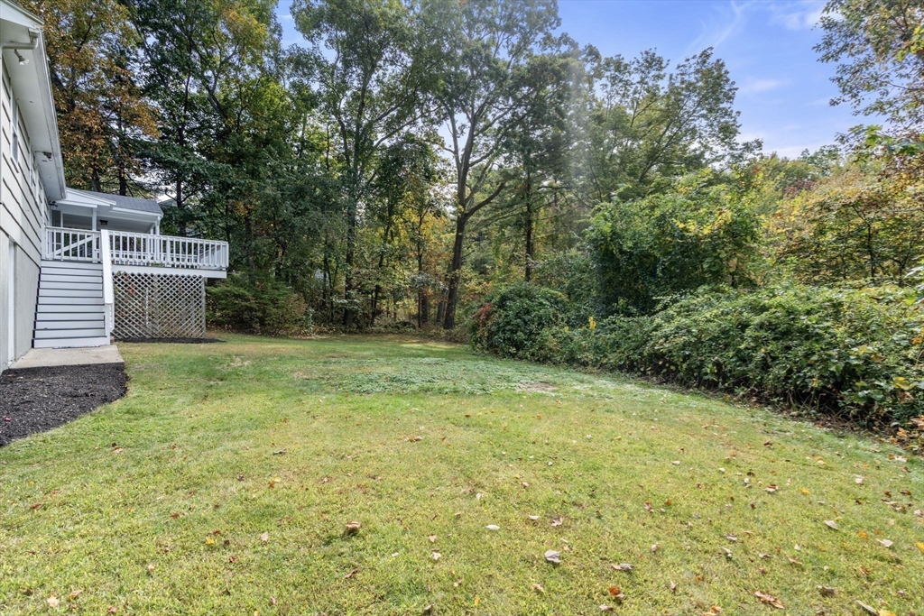 5 Oakwood Road Acton, MA 01720 - Photo 15 of 17 a view of a backyard