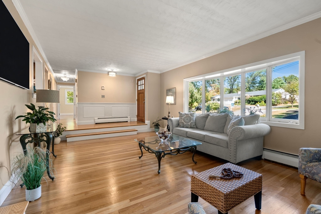 5 Oakwood Road Acton, MA 01720 - Photo 2 of 17 a living room with furniture and a large window