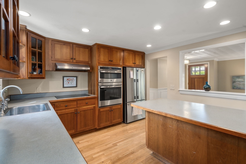 5 Oakwood Road Acton, MA 01720 - Photo 3 of 17 a large kitchen with stainless steel appliances granite countertop a refrigerator and a sink