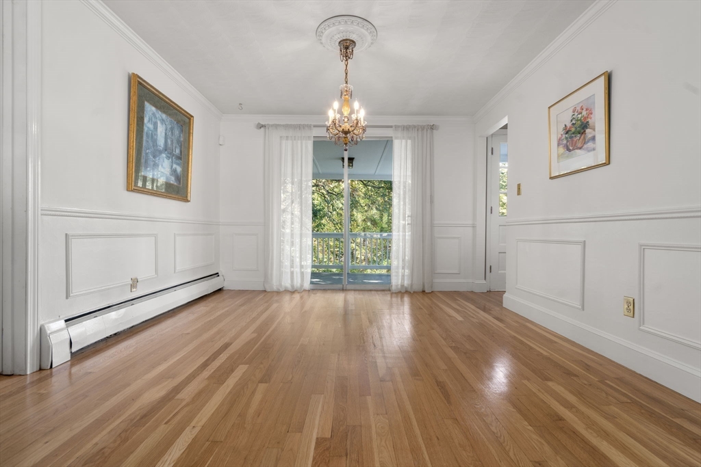 5 Oakwood Road Acton, MA 01720 - Photo 4 of 17 a view of empty room with wooden floor and window